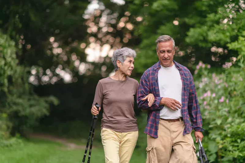 middle-aged couple walking outside